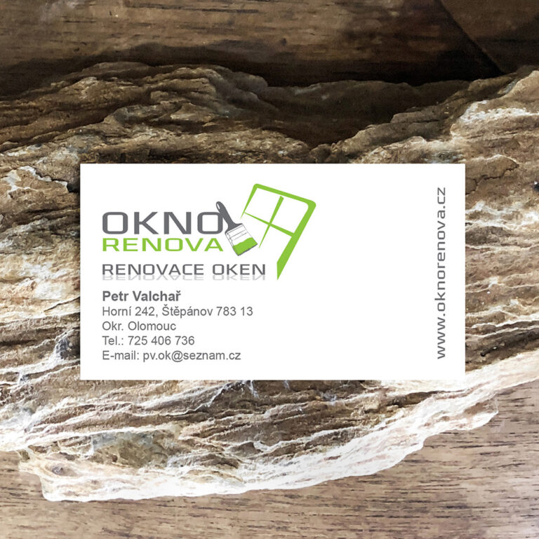 Clean minimal business card mockup on table with rock and plant foreground. PSD file.
